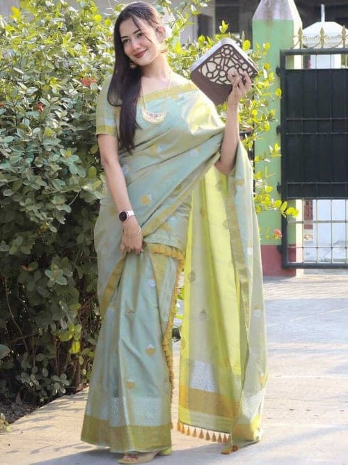Green and gold Ethnic motifs woven design saree with zari border